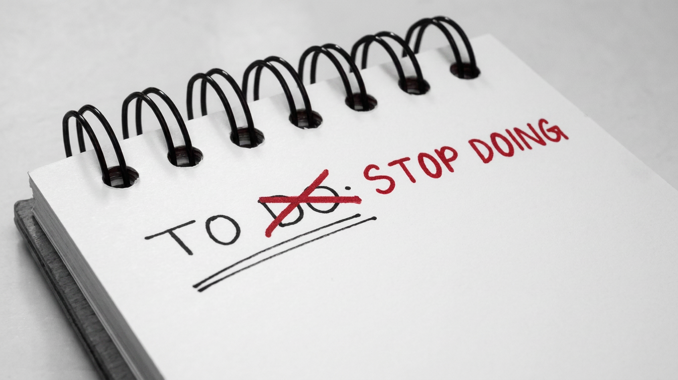 A notepad with a title crossed out that reads 'TO DO:' and the words 'STOP DOING' written in red ink.